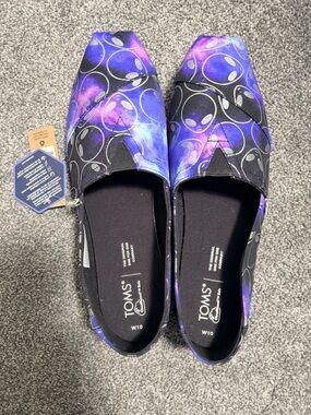 TOMS Women’s Black Foil Alien Galaxy Print Slip-Ons